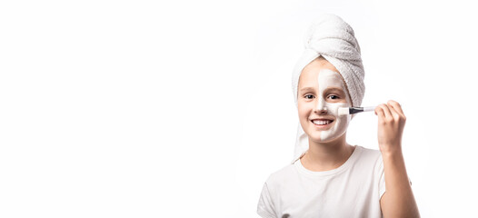 Skin care and spa treatments. Emotional portrait of a positive and cheerful beautiful teen girl with cosmetic mask on her faceon a white background. banner, panorama