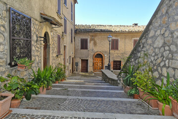 A narrow street between the old houses of the town of Vico nel Lazio, in the province of Frosinone