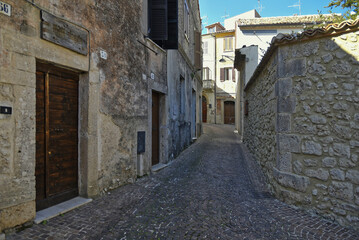 A narrow street between the old houses of the town of Vico nel Lazio, in the province of Frosinone