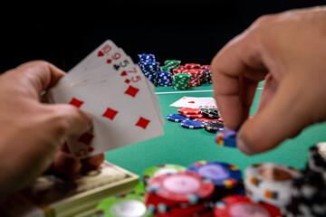 Playing poker holding cards
