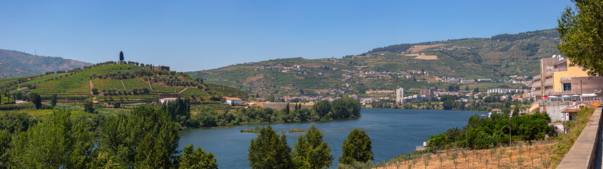 Panoramic aerial view at the Douro river on Regua, typical landscape of the highlands in the north of Portugal, levels for agriculture of vineyards