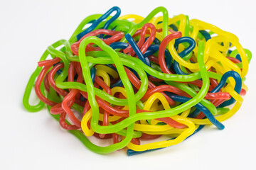 heap of chewy gummy candy spaghetti strings