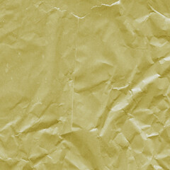 Yellow vintage and old looking crumpled paper background. Retro cardboard texture. Grunge paper for drawing. Ancient book page. Present wrapping.