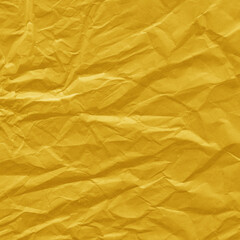 Yellow vintage and old looking crumpled paper background. Retro cardboard texture. Grunge paper for drawing. Ancient book page. Present wrapping.