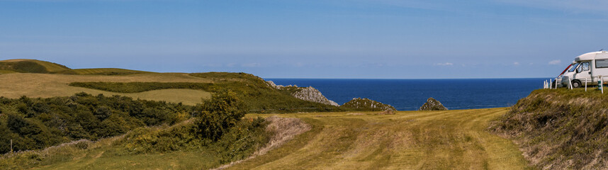 Panoramic view of a beach from a country road