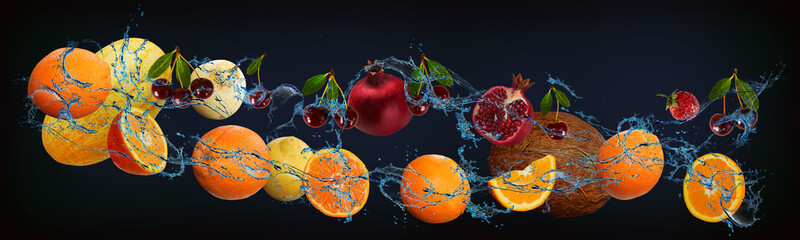 Panorama with fresh fruits in the water - melon, orange, pear, cherry, lemon, pomegranate, coconut, strawberry, a very tasty dessert for the New Year, Christmas and Halloween