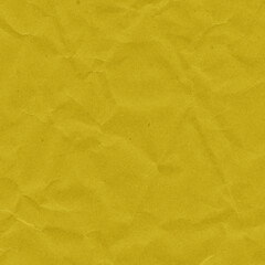 Yellow vintage and old looking crumpled paper background. Retro cardboard texture. Grunge paper for drawing. Ancient book page. Present wrapping.