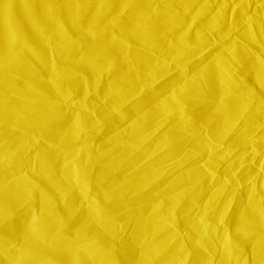 Yellow vintage and old looking crumpled paper background. Retro cardboard texture. Grunge paper for drawing. Ancient book page. Present wrapping.