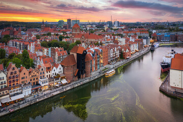 Aerial view of the Gdansk city over Motlawa river with amazing architecture at sunset,  Poland