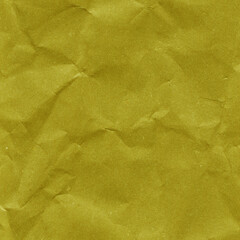 Yellow vintage and old looking crumpled paper background. Retro cardboard texture. Grunge paper for drawing. Ancient book page. Present wrapping.
