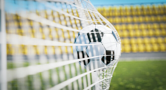 Goal in football - soccer ball in the net, sunny day
