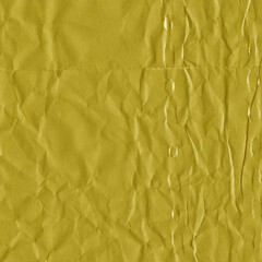 Yellow vintage and old looking crumpled paper background. Retro cardboard texture. Grunge paper for drawing. Ancient book page. Present wrapping.