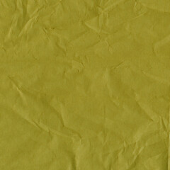 Yellow vintage and old looking crumpled paper background. Retro cardboard texture. Grunge paper for drawing. Ancient book page. Present wrapping.