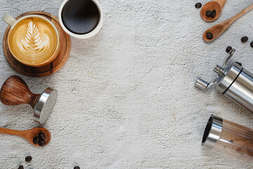 A cup of coffee and Coffee equipment on white, concrete background , Top view , Copy Space.