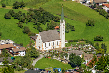Aerial view of the Pfarrkirche Maria Himmelfahrt parish church in the historic center of Prutz,...