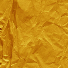 Yellow vintage and old looking crumpled paper background. Retro cardboard texture. Grunge paper for drawing. Ancient book page. Present wrapping.