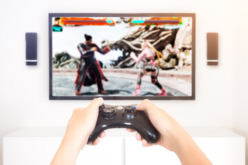 Player playing console fitghting videogame holding gamepad - high key image