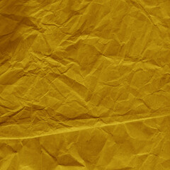 Yellow vintage and old looking crumpled paper background. Retro cardboard texture. Grunge paper for drawing. Ancient book page. Present wrapping.