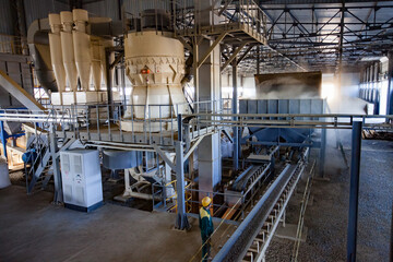 Aktobe province, Kazakhstan - May 04, 2019: Phosphate fertilizers plant. Full circle Pellets production line. Operator controls process.