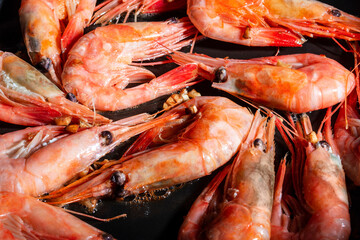 Shrimp with garlic roast in a pan. Close up.