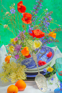 Still life with wild flowers in a soup cup
