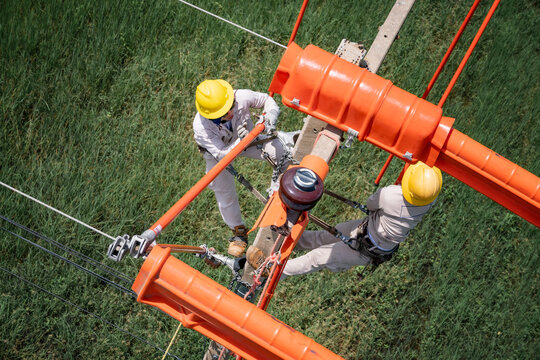 The lineman used tie stick to carve the tie wire used to wrap the electrical wires attached to the damaged high voltage insulator. In order to prepare to replace the damaged equipment