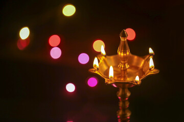 Colorful clay diya lamps lit during diwali celebration