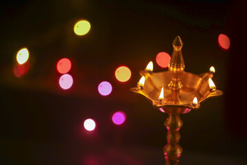 Colorful clay diya lamps lit during diwali celebration