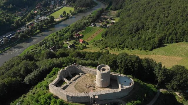 Aerial view of medieval castle and Poprad river in summer. Beskid Mountains, village Rytro, Poland.