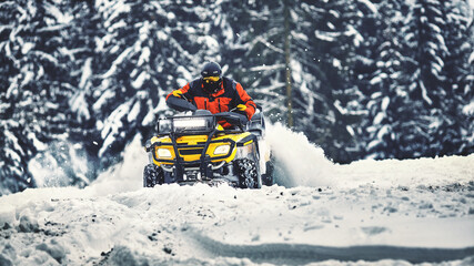 Winter walk on the quad bike in the forest. © 6okean