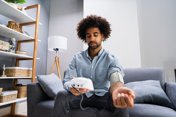 African Patient Doing Blood Pressure Check