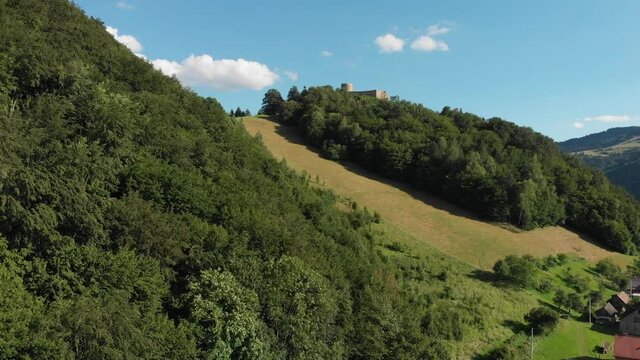 Beskid Mountains and medieval castle in summer. Rytro village, Poland.