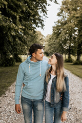 Fototapeta premium Close up of romantic couple in embrance look to each other on nature background