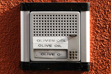 Door bell with sign for olive oil sale