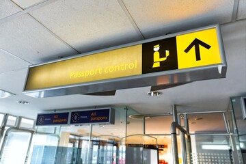 Signs for the border control at an international airport terminal