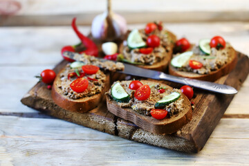 Selective focus. Sandwiches with pâté and cherry tomatoes.