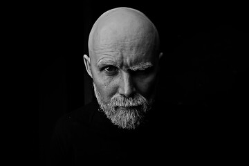 Obraz premium brutal bald bearded man / studio isolate, photo guy with a gray beard, bald head