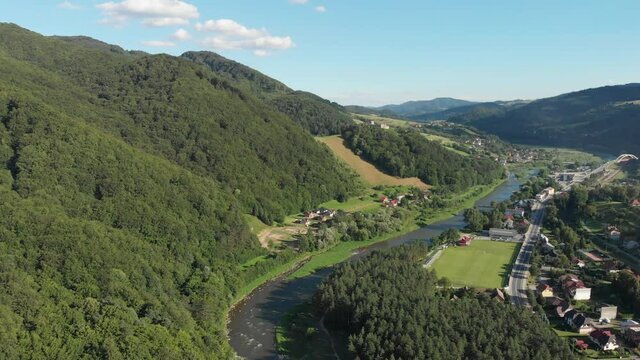 Aerial view of village Rytro and Poprad river in summer