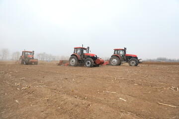 seeder sows in the field, North China