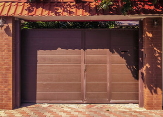 Modern, automatic and convenient garage doors opening for a car