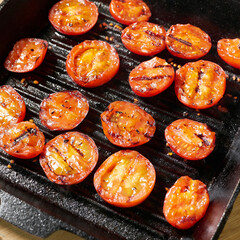 cherry tomatoes baked in a cast-iron frying pan