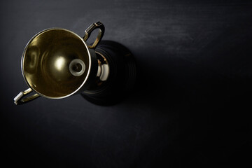 winning trophy on blackboard