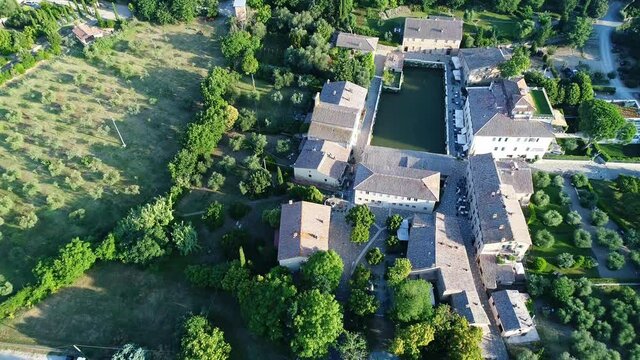 Aerial view of Bagno Vignoni a village in Val D'orcia. Spas, nature and a beautiful landscape