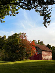 Fototapeta na wymiar Red barn in autumn, October 2020