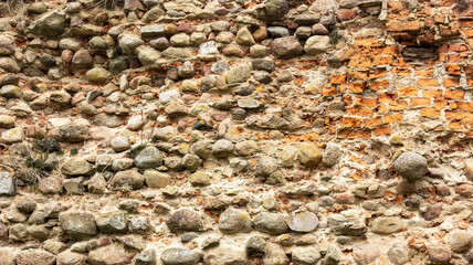 Old destroyed stone wall. Brickwork visible Belarus