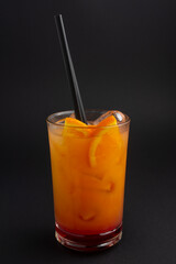 Tequila sunrise cocktail on dark background