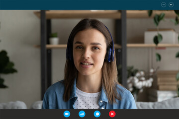 Screen application view of millennial Caucasian woman in headphones have webcam training or webinar...