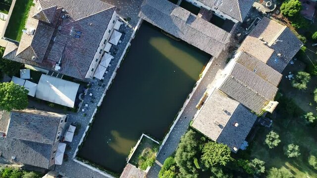 Aerial view of Bagno Vignoni a village in Val D'orcia. Spas, nature and a beautiful landscape