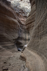 Tobas de Colores, Barranco de las Vacas, Gran Canaria, large mountains made of smooth and colorful stone.