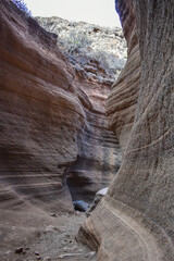 Tobas de Colores, Barranco de las Vacas, Gran Canaria, large mountains made of smooth and colorful stone.